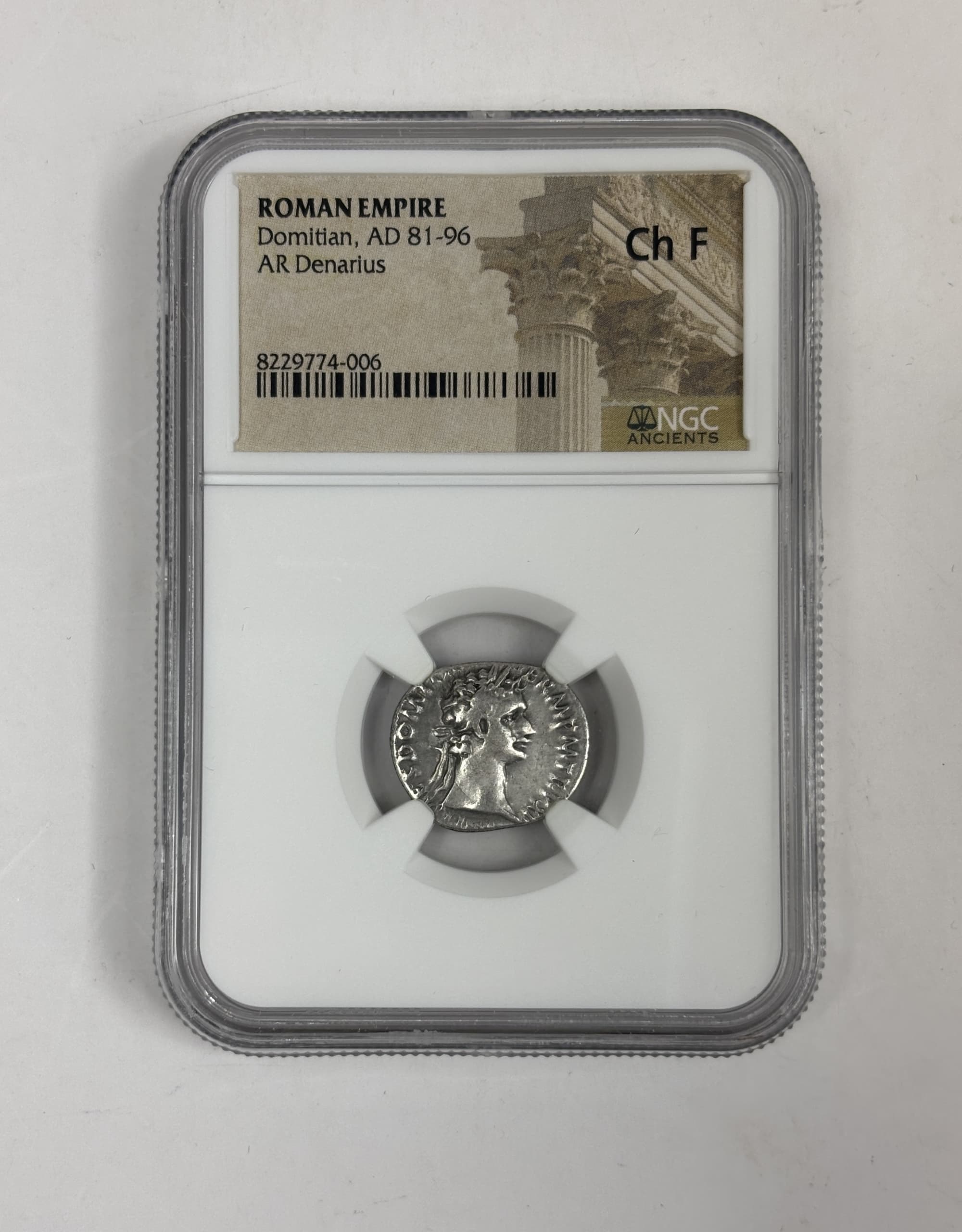 NGC-Certified Roman Coin: Domitian, Denarius, Grade CH-F β representative ECC supplier stock image; exact coin and slab vary