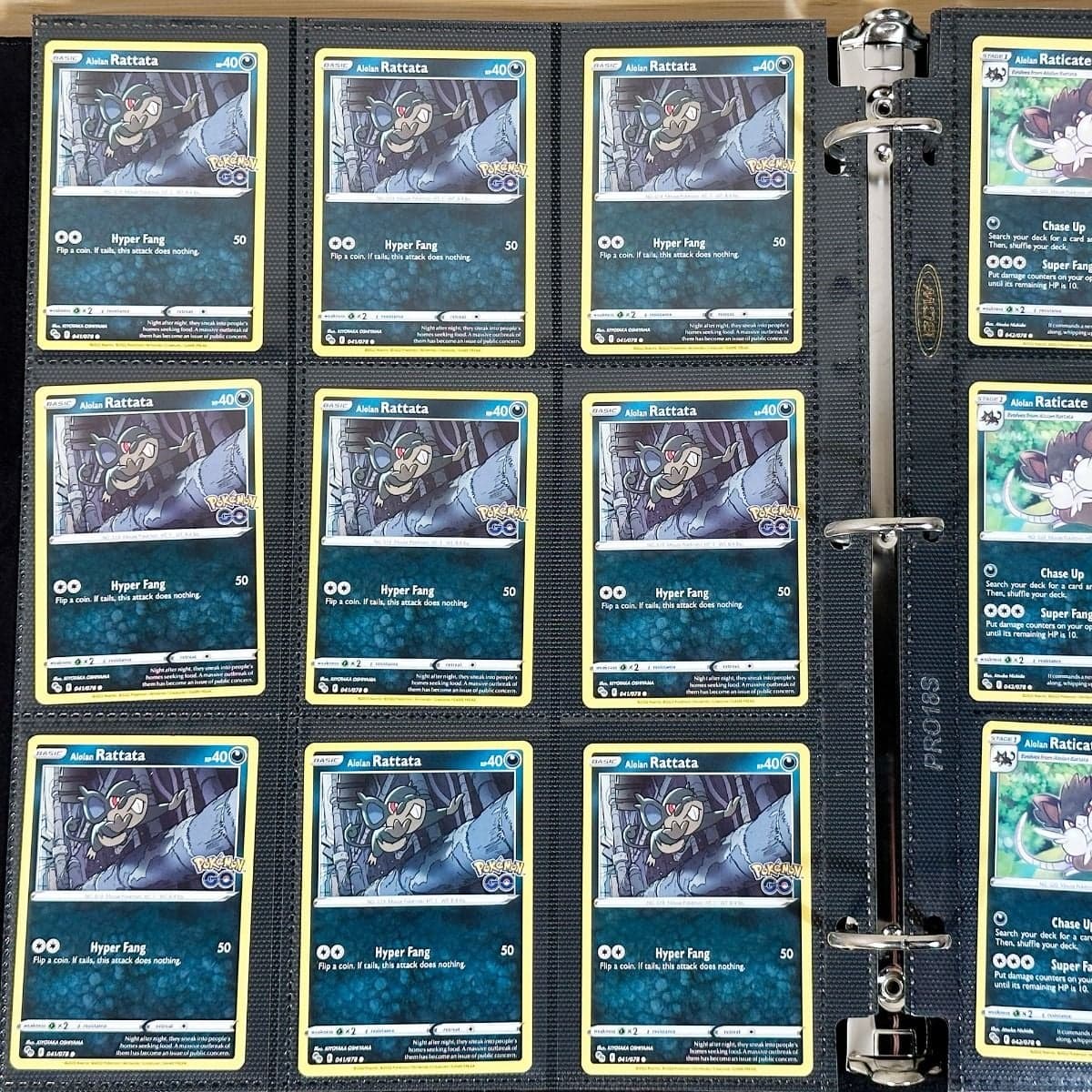 BCW Side Loading Pro 18 pages - black. In binder filled with pokemon gaming cards
