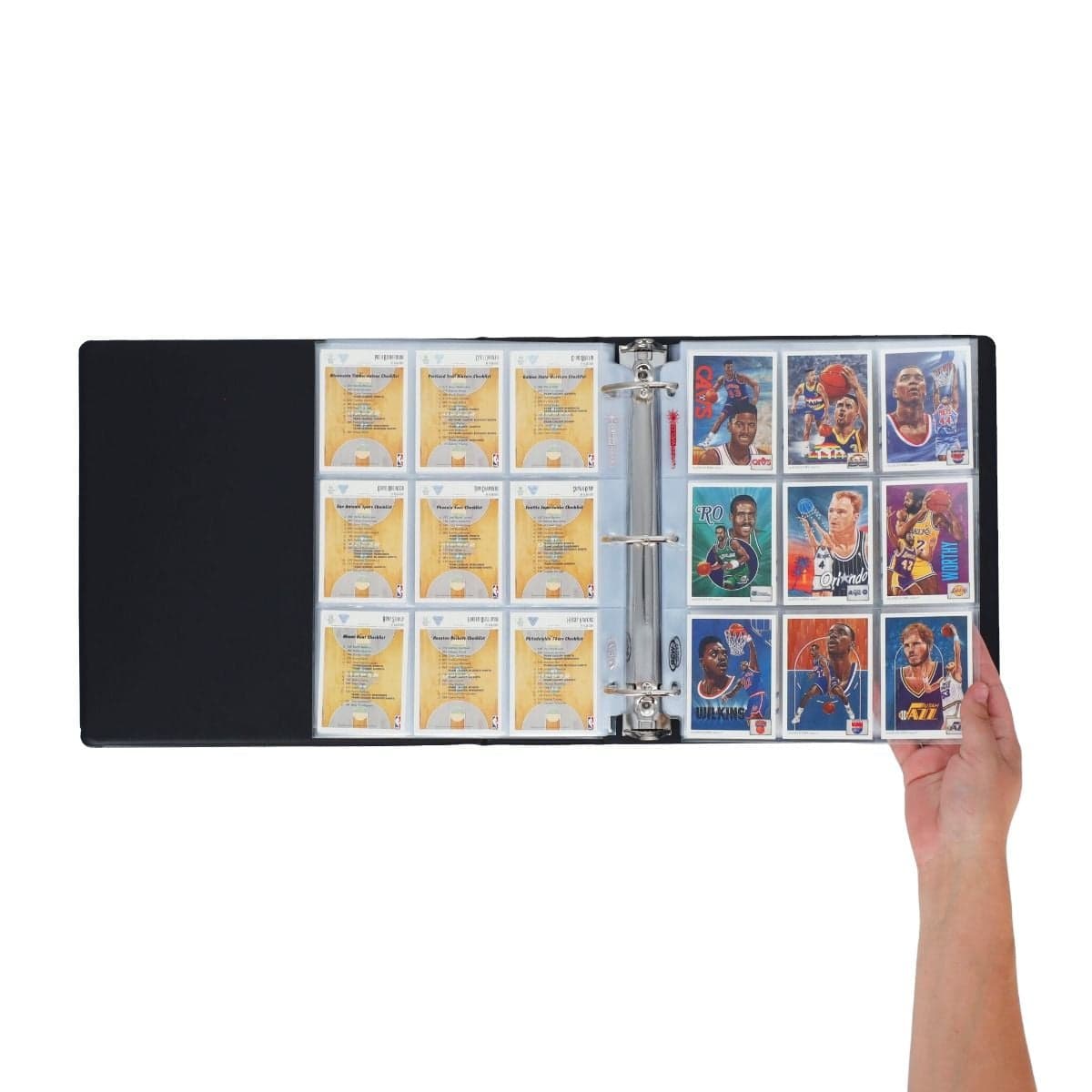 BCW 3 in. Album - Basketball - Black, opened revealing stored basketball cards, hand flipping through the pages.