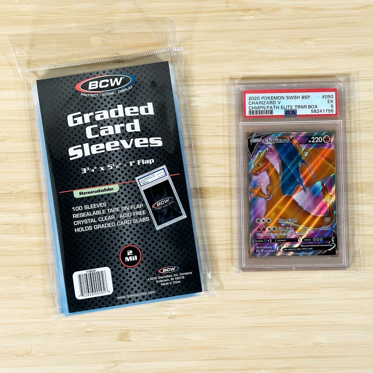 BCW Resealable Graded Card Sleeves packaging grouped with a single sleeved pokemon card