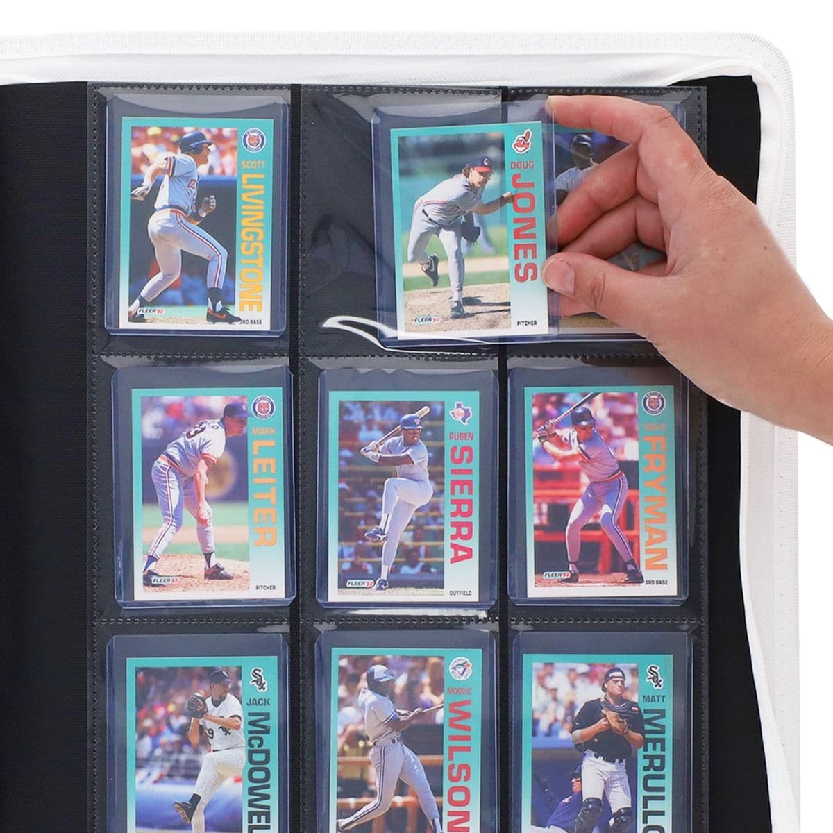 BCW Z-Folio 9-Pocket LX Album - Toploaders - White hand inserting toploaded card into page