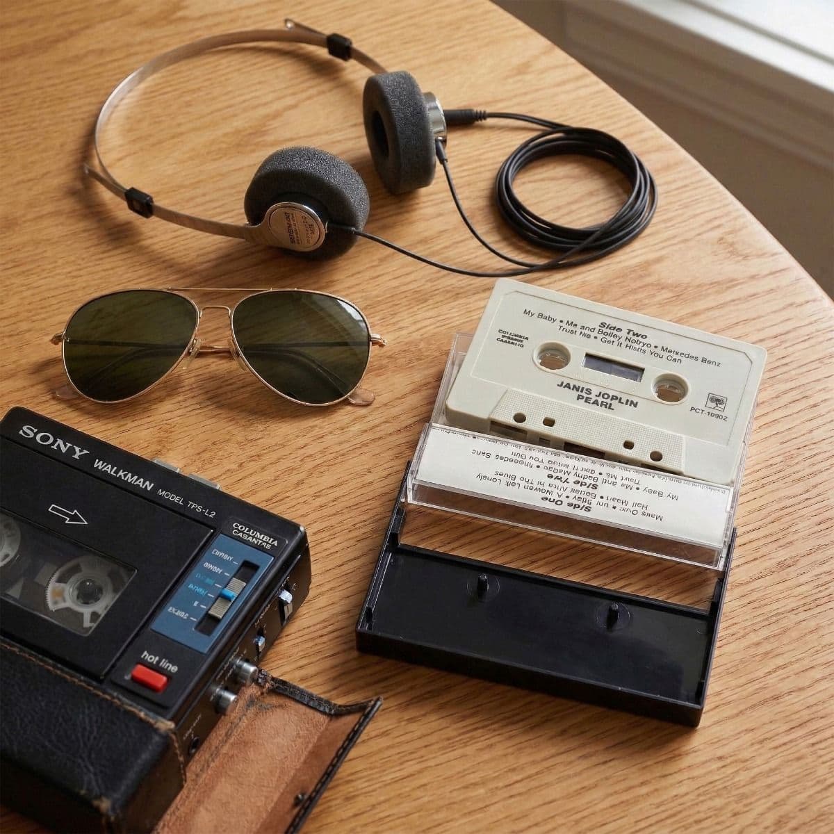 BCW Black Cassette Case on table next to Sony Walkman and headphone