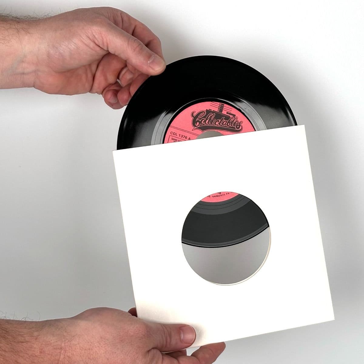 7 Inch Record Paper Jacket - With Hole - White inserting record into jacket