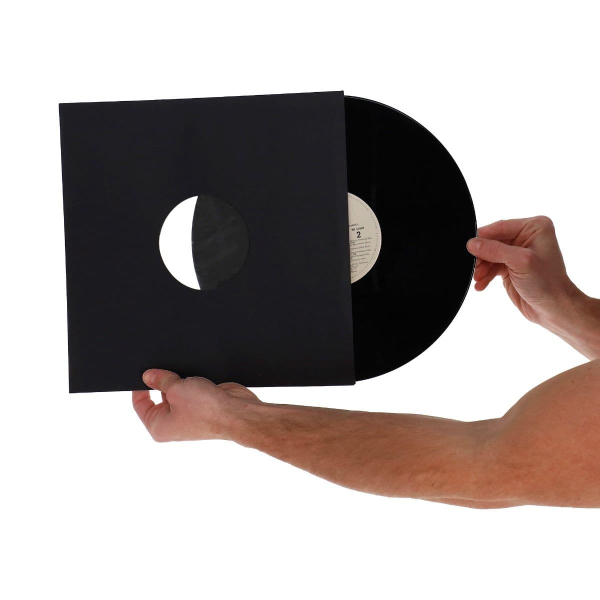 BCW 12 Inch Record Paper Inner Sleeves - Polylined - With Hole - Black, hand holding and inserting a record into the inner sleeve
