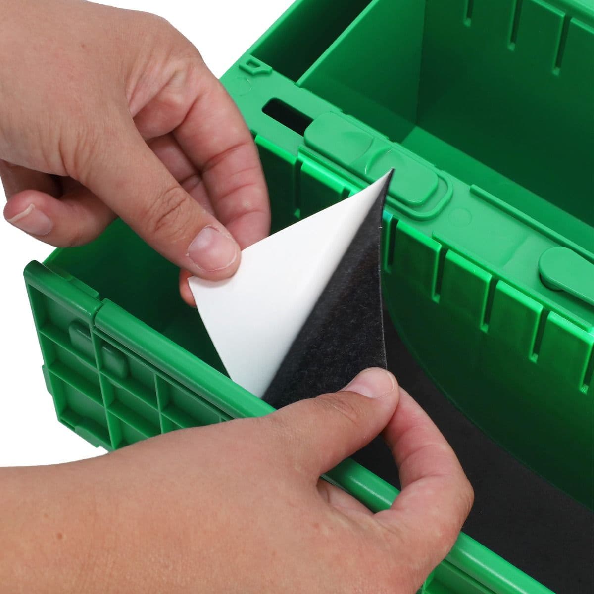 BCW Slip Guard Strip being applied to the bottom of a BCW 1600 Count Collectible Card Bin
