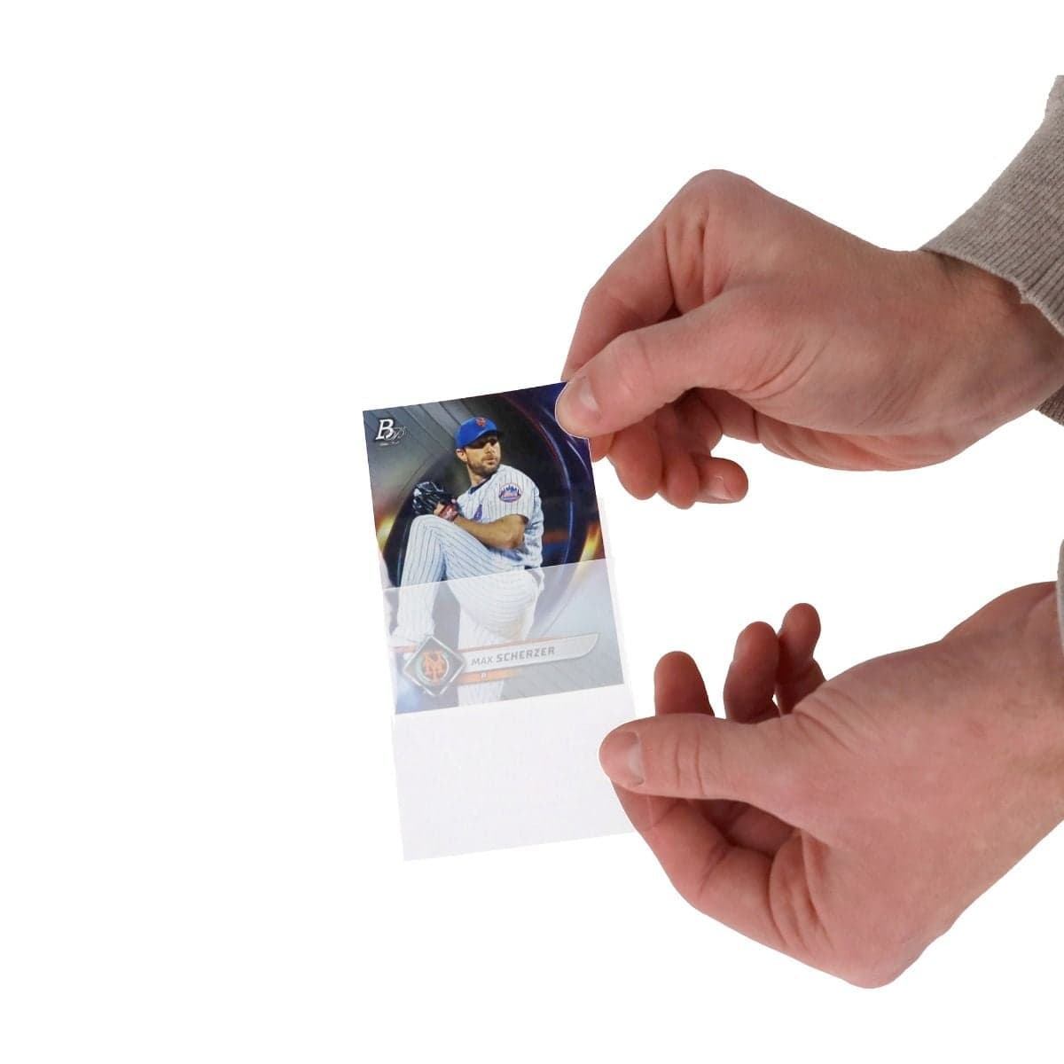 hand inserting baseball card into single sleeve