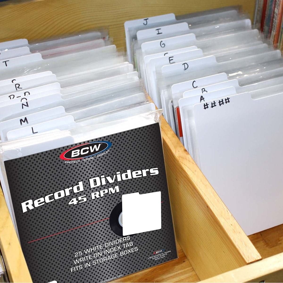 Package of BCW 45 RPM Record Dividers - White with several records and dividers