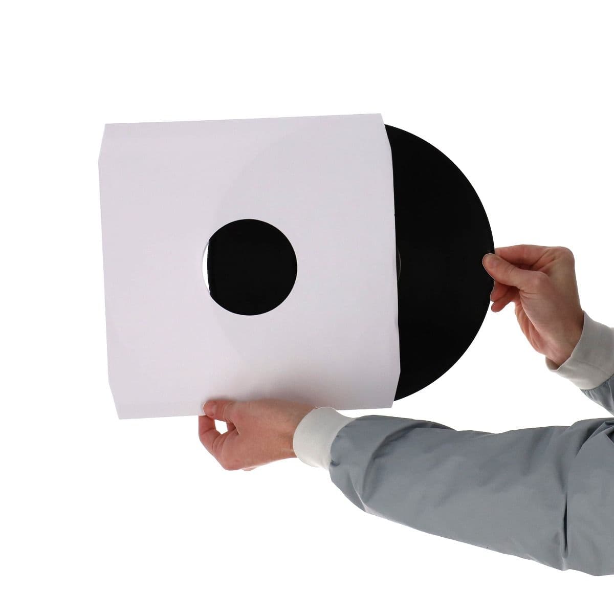 BCW 12 Inch Record Paper Inner Sleeve - Cut Corners - White, hands holding and inserting a record into the inner sleeve