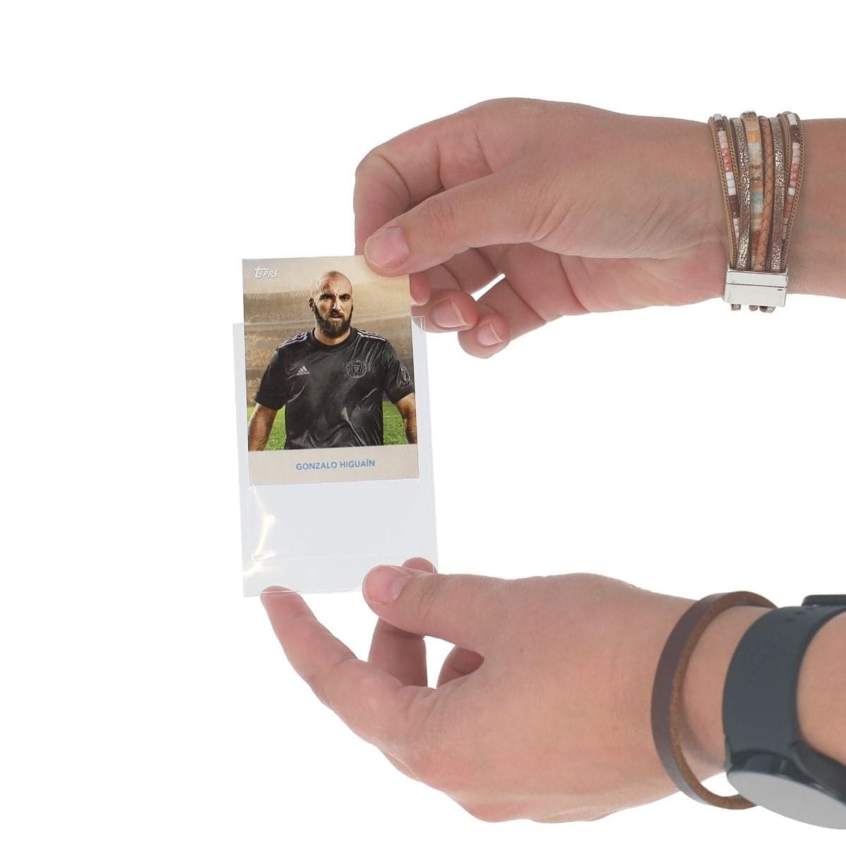 Hands inserting a card into a BCW 48 Bowman Insert Sleeve