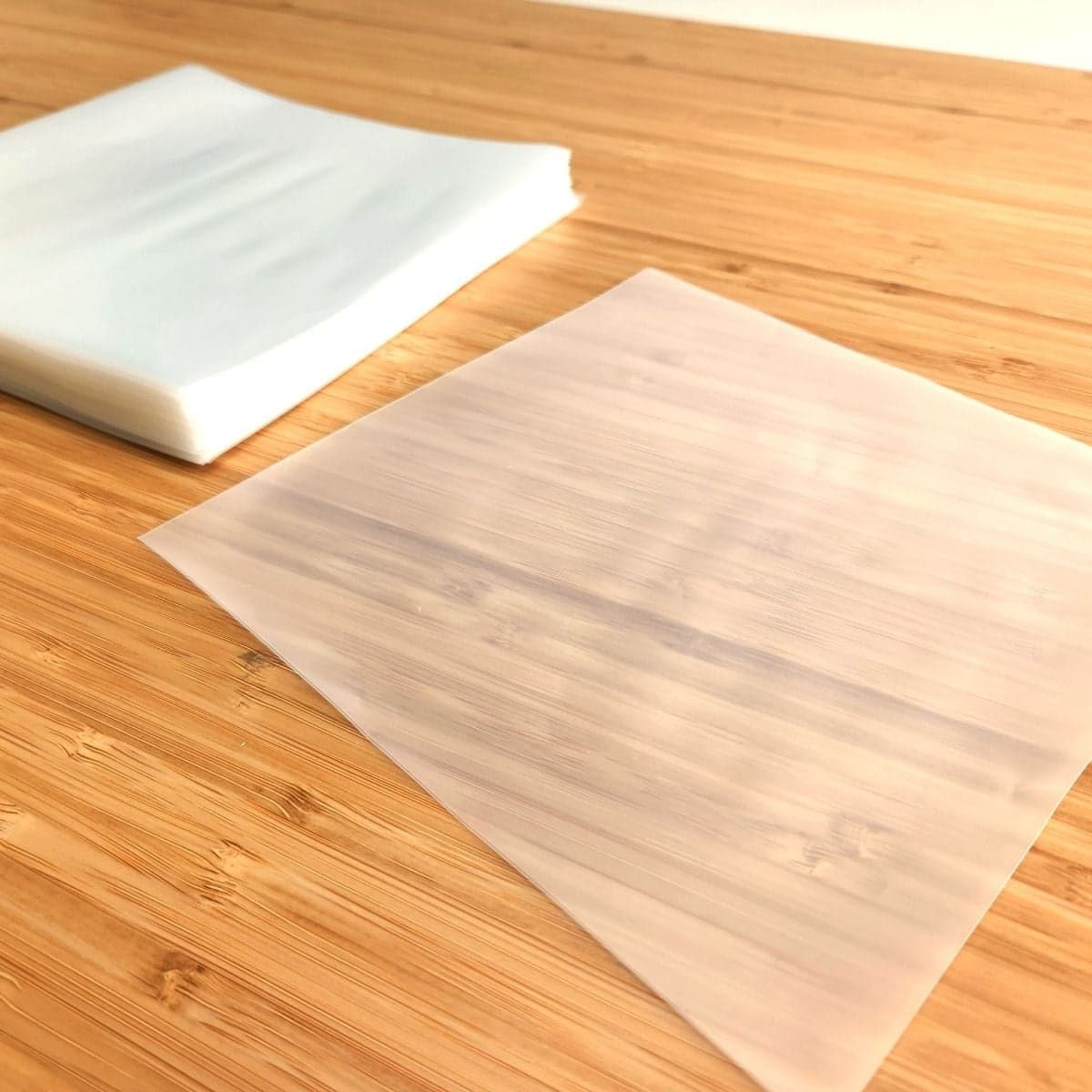Empty sleeve next to stack of BCW 7 Inch Record Inner Sleeve - Anti-static