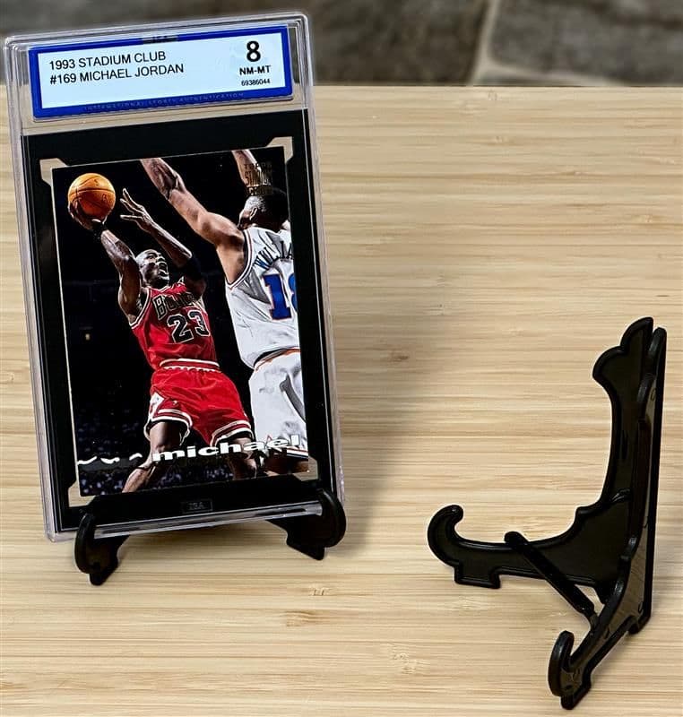 BCW Foldable Card Stand holding a graded Michael Jordan card group with an empty stand