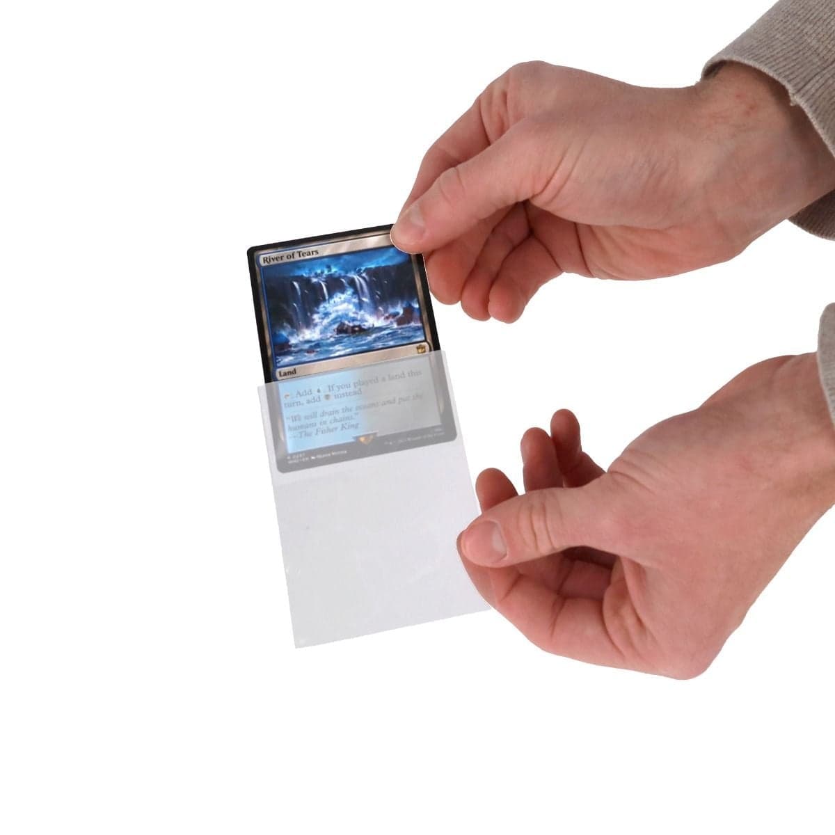 hand inserting magic card into single sleeve