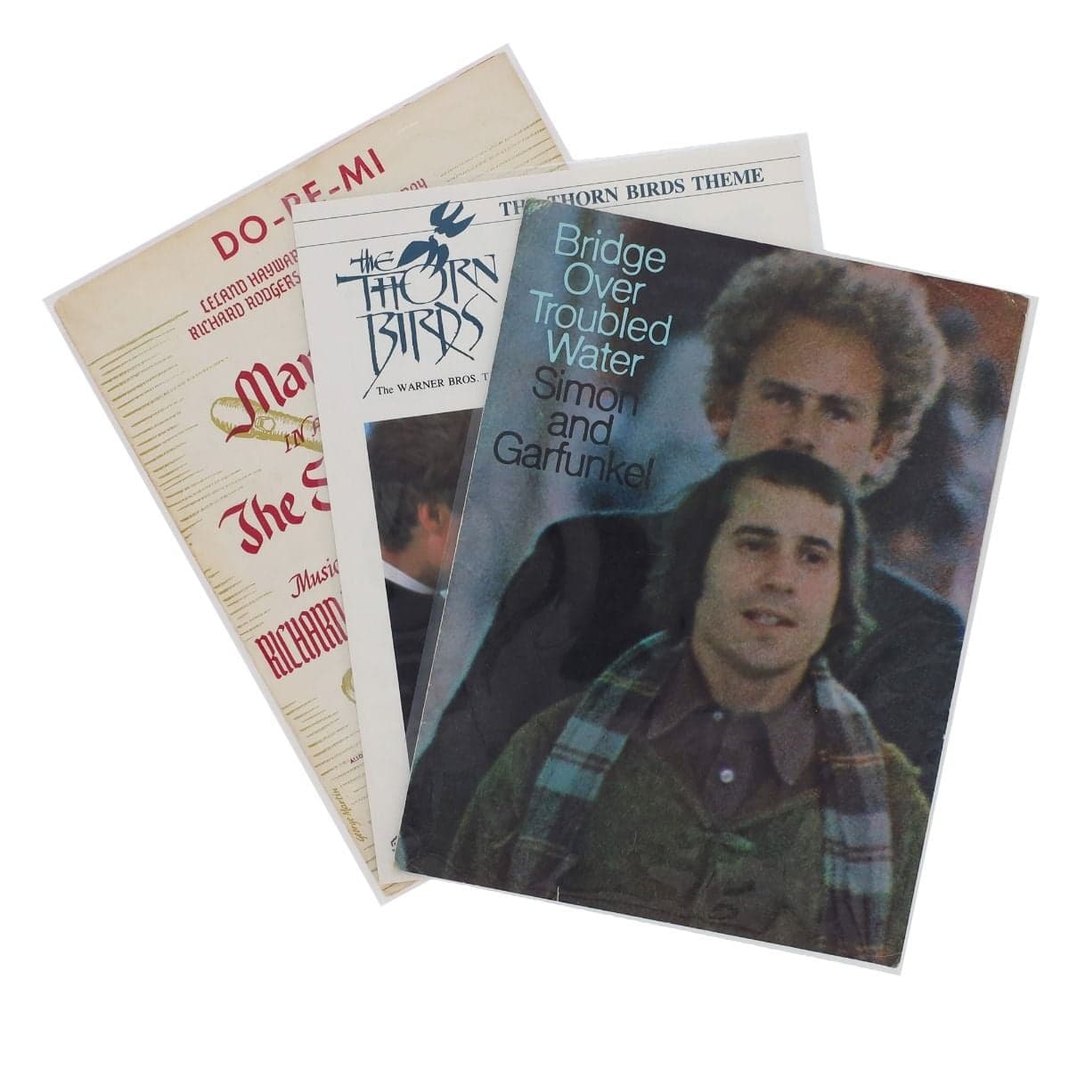Three vintage sheet music booklets displayed in BCW Sheet Music Sleeves, showing clear visibility and archival protection for collectible music scores and covers.