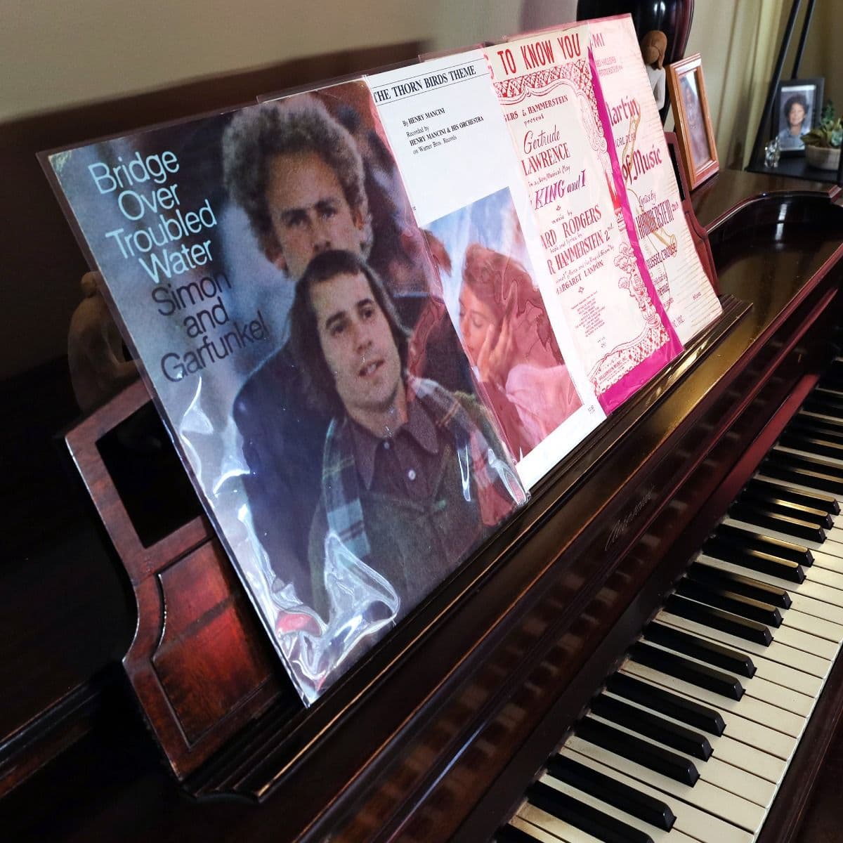 Sheet music protected in BCW polypropylene sleeves is displayed on a piano, showcasing clear visibility, organized presentation, and long-term preservation for collectible music scores.