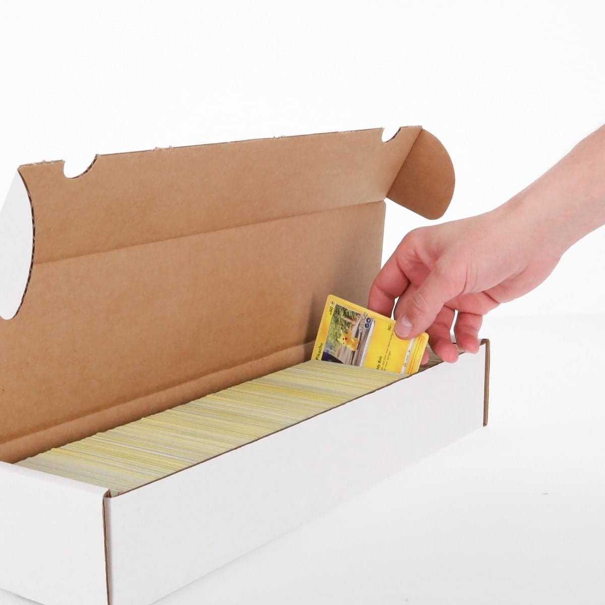 BCW 1000 count gaming storage box. Inserting card