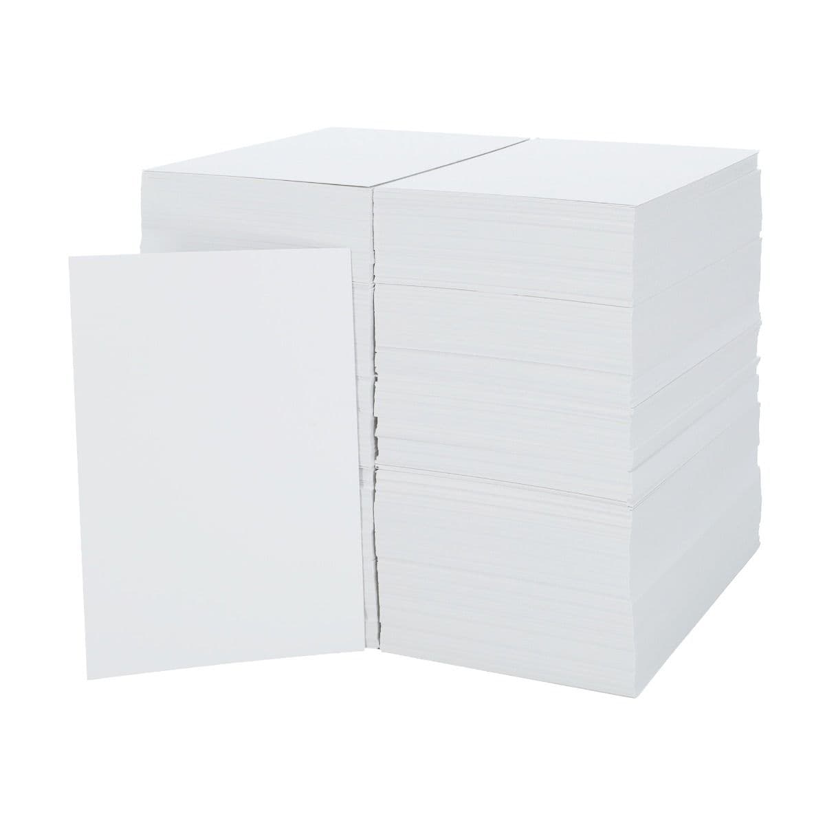 Image of 2 giant stacks of backing boards with a board standing upright to the front left of the stacks.