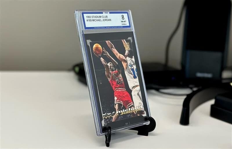 BCW Foldable Card Stand black holding a graded Michael Jordan card
