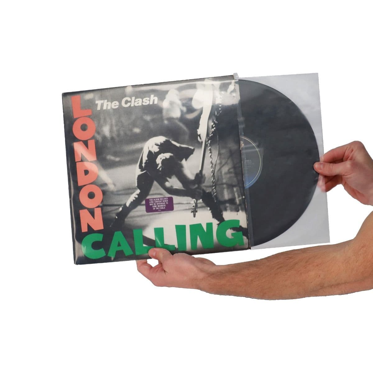 BCW 12 Inch Record Inner Sleeve - Anti-Static, hand holding and inserting the sleeved record into it's record jacket