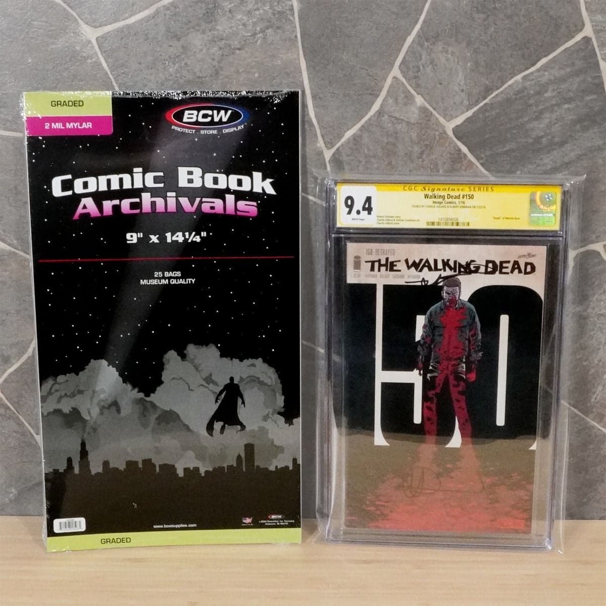 Image of BCW packaging to left, Graded The Walking Dead comic to the left inside the comic bag