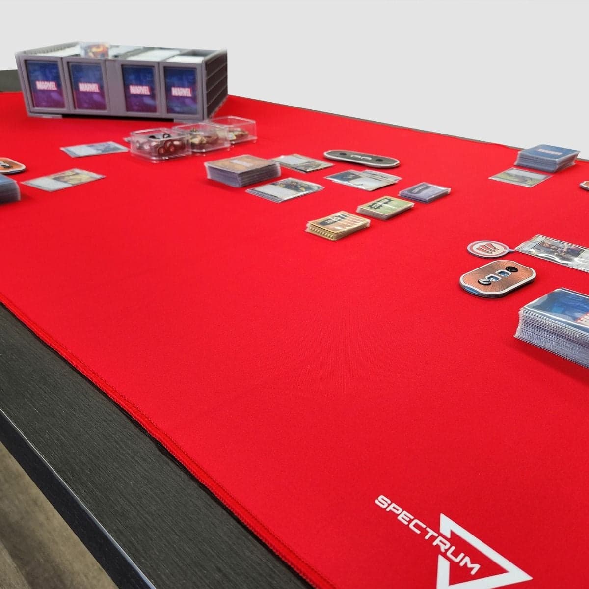 Spectrum Playmat XL Red on tabletop with Marvel