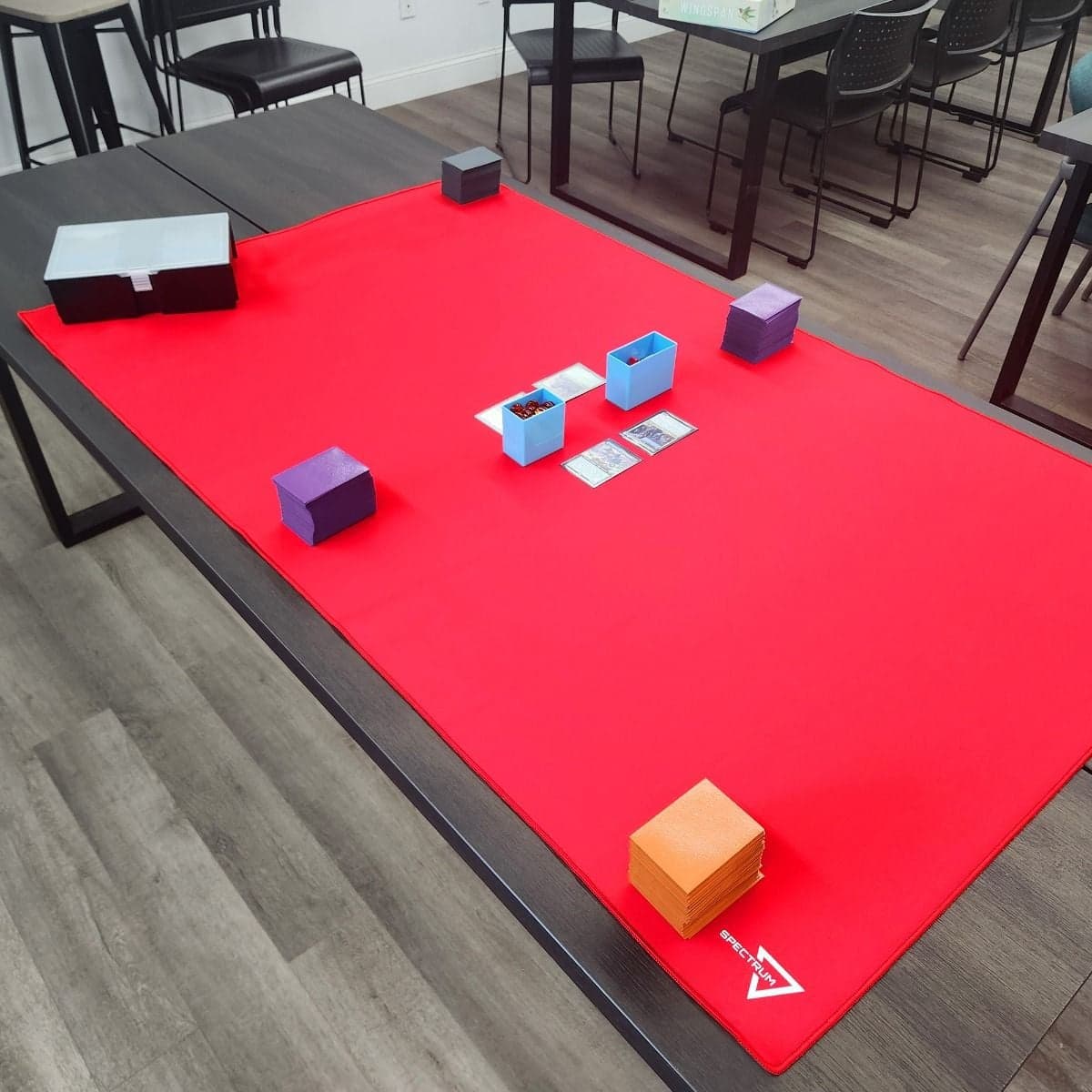 Spectrum Playmat XL Red on tabletop with MTG