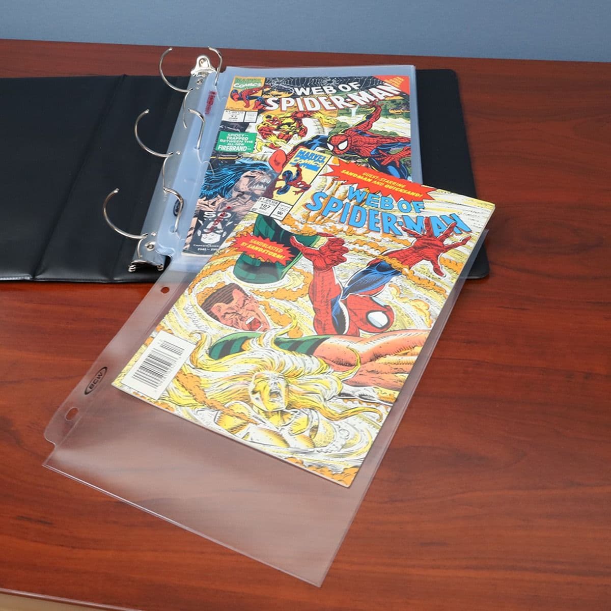 LaserWeld Comic Pages in binder with comics on display
