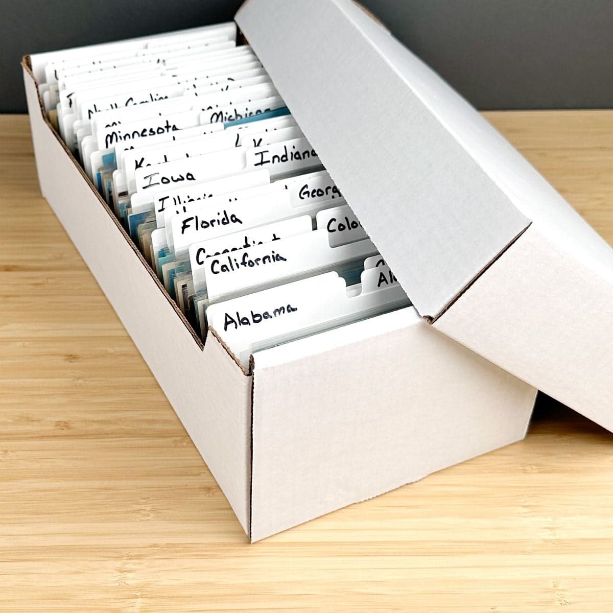 Open BCW Postcard Storage Box with Post cards and BCW post card dividers labeled