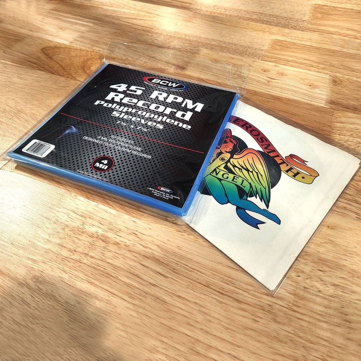 Angled image of BCW 45 RPM Record Sleeves - 4 MIL on top of record