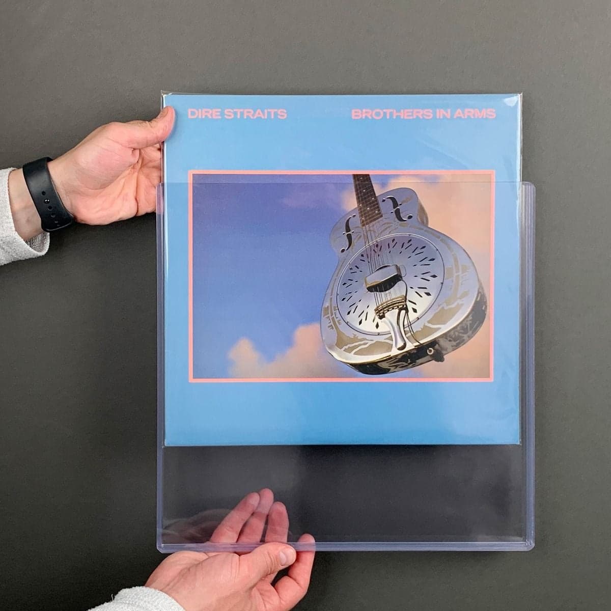BCW 12 Inch record toploaders, SNUG Fit, with 9mm opening. 5 holders per pack. Holds a single LP. Inserting sleeved 12 in record into holder