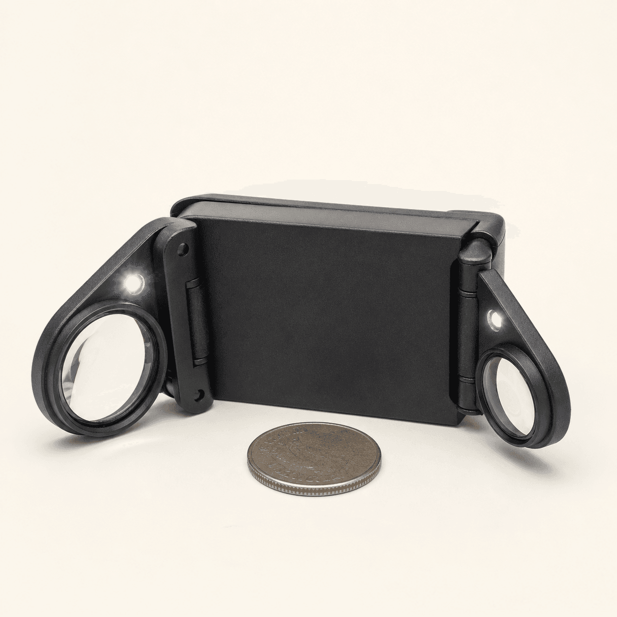 Original representative image of a black pocket loupe with two folding illuminated lenses.