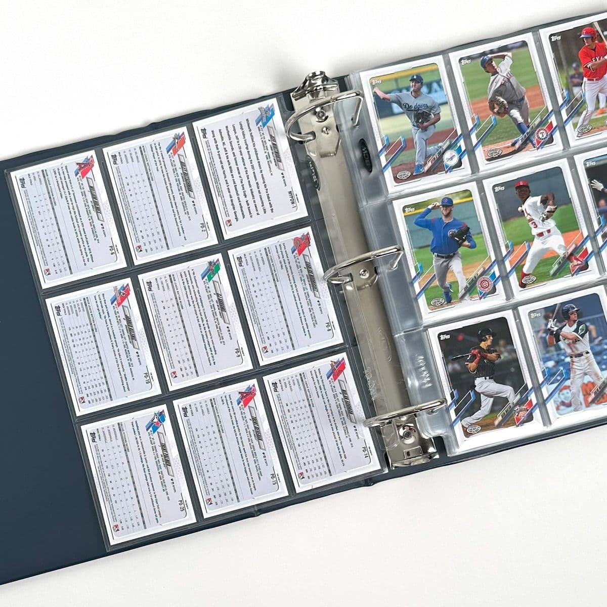 BCW blue baseball card album with baseball cards and BCW pages