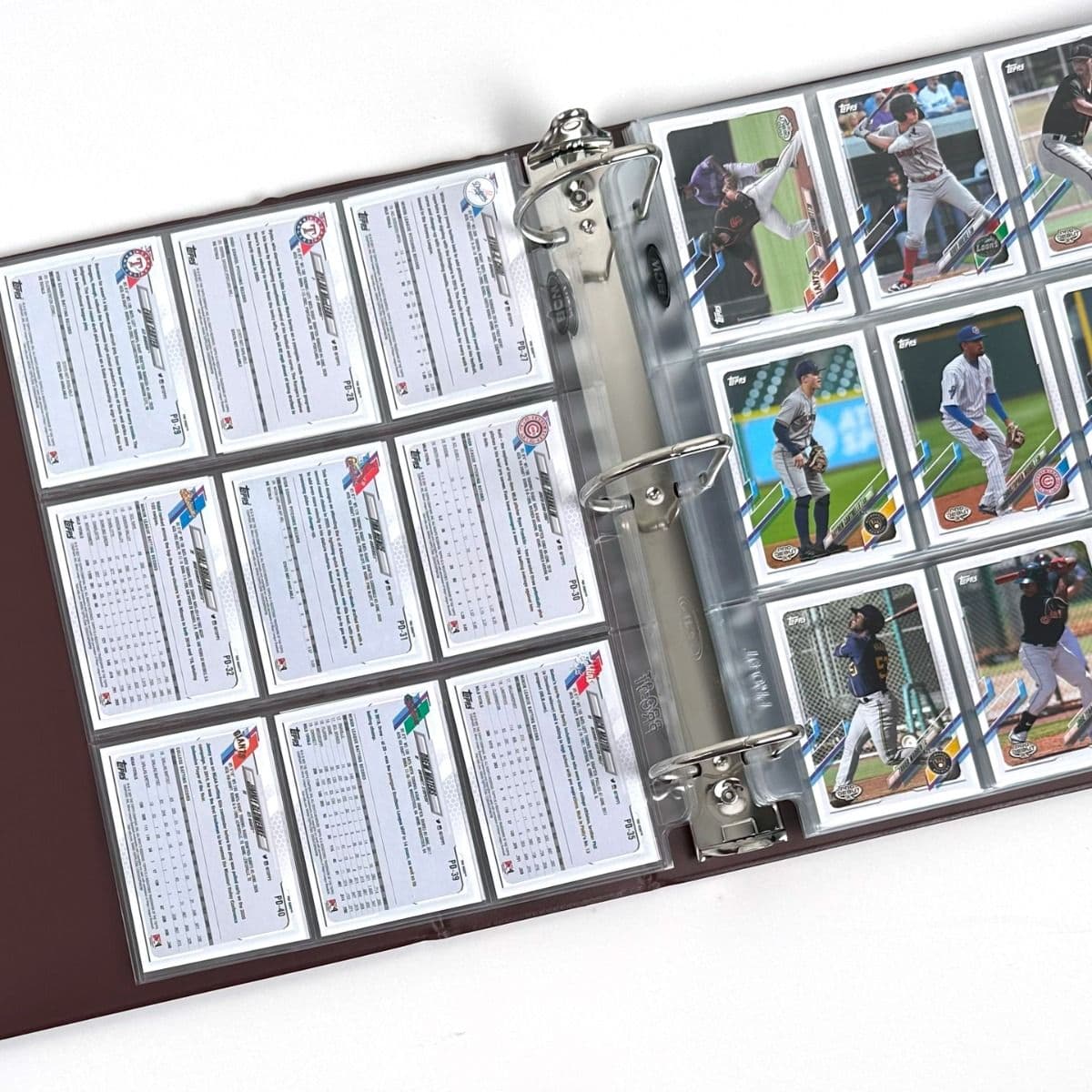 BCW burgundy baseball card album with baseball cards in BCW pages