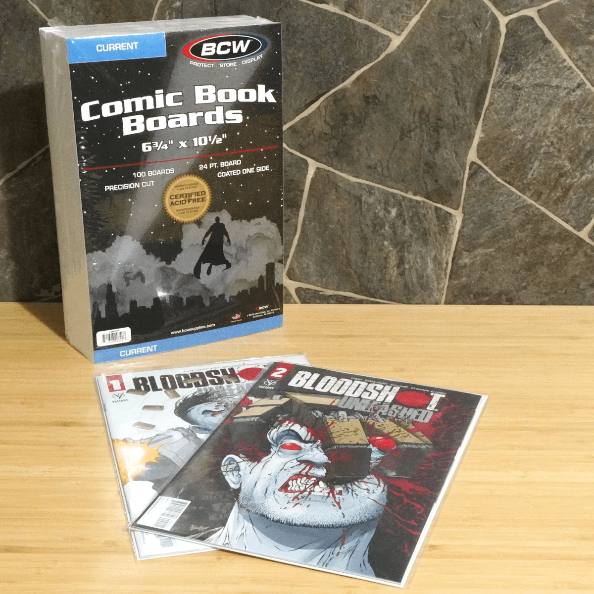 Packaging of BCW Current Comic Backing Boards displayed with bagged and boarded comics