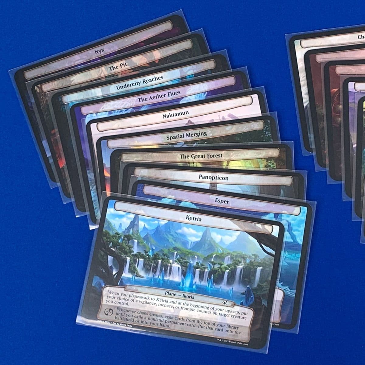 Spread of Planechase cards in BCW 89x127 Board Game sleeves
