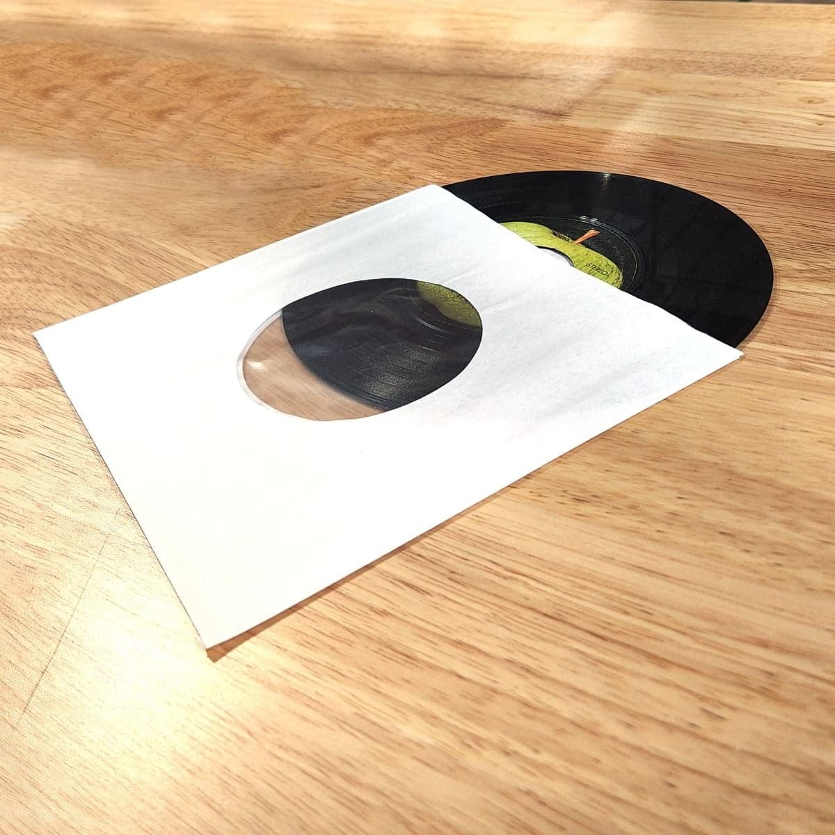 Record sticking out of sleeve