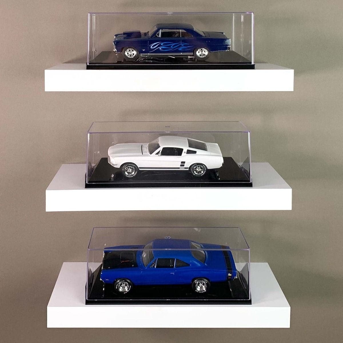 Three BCW one twenty-fourth Scale Car Display Cases on shelves