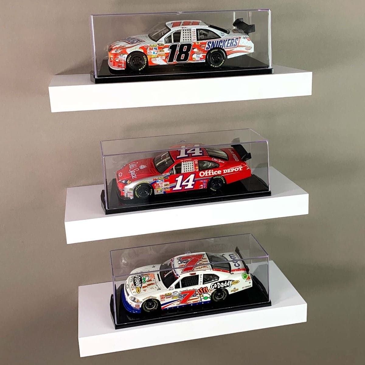 Three BCW one twenty-fourth Scale Car Display Cases displayed on shelves